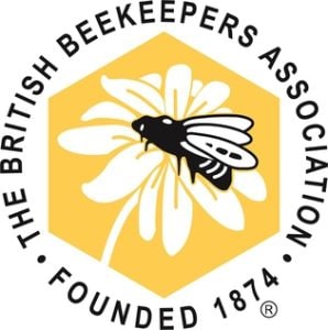 Circular logo of the British Beekeepers Association with a stylized bee in the centre.