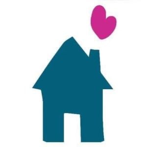 A drawing of a bright blue house with a chimney and a pink heart shape cutout flying out of it.
